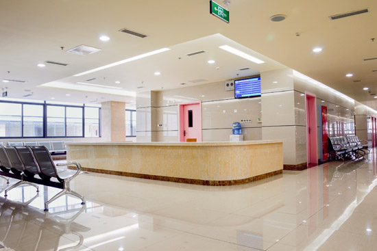 Brightly illuminated hospital waiting room area with high quality lighting
